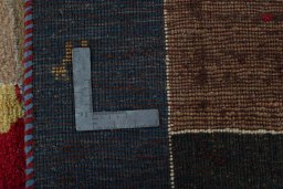 Close-up detail of 2000s Persian Gabbeh rug from Pakistan showing Wool weave