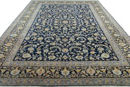Surface texture of 2000s Kashan rug with natural Wool and intricate pattern