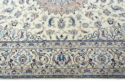 Corner detail of 2000s Nain rug showing border pattern and Wool pile