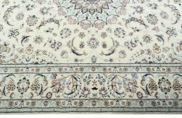 Corner detail of 2000s Nain rug showing border pattern and Wool pile