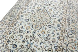 Backside of handmade New Kashan rug showing knot structure and weave density