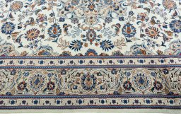 Corner detail of 2000s Kashmar rug showing border pattern and Wool pile