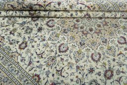 Close-up detail of 2000s Kashan rug from Iran / Persia showing Wool weave