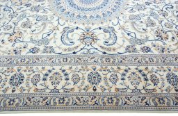 Corner detail of 2000s Nain rug showing border pattern and Wool pile