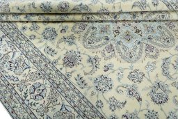 Close-up detail of 2000s Nain rug from Iran / Persia showing Wool weave