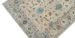 Backside of handmade New Farahan rug showing knot structure and weave density