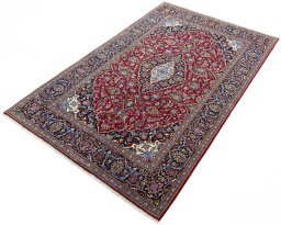 Corner detail of New Kashan rug showing border pattern and Cork pile