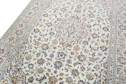 Backside of handmade 2000s Kashan rug showing knot structure and weave density