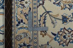 Backside of handmade 2000s Nain rug showing knot structure and weave density