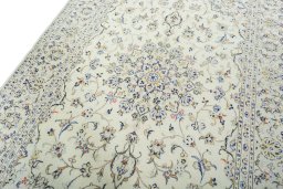 Backside of handmade 2000s Kashan rug showing knot structure and weave density
