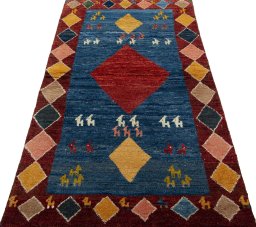 Surface texture of 2000s Persian Gabbeh rug with natural Wool and intricate pattern