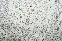 Close-up detail of 2000s Nain rug from Iran / Persia showing Wool weave