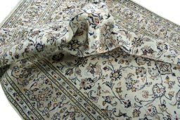 Surface texture of 2000s Kashan rug with natural Wool and intricate pattern