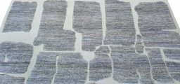 Backside of handmade New Morocco rug showing knot structure and weave density