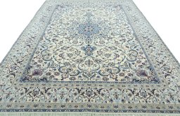 Surface texture of 2000s Nain rug with natural Wool and intricate pattern