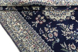 Close-up detail of 2000s Nain rug from Iran / Persia showing Wool weave