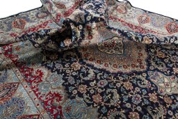 Surface texture of 1970s Kashmar rug with natural Wool and intricate pattern