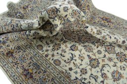Surface texture of 2000s Kashan rug with natural Wool and intricate pattern