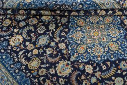 Close-up detail of 2000s Kashan rug from Iran / Persia showing Wool weave