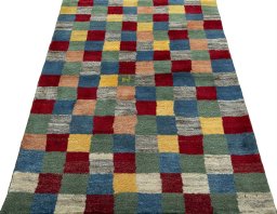 Surface texture of 2000s Persian Gabbeh rug with natural Wool and intricate pattern