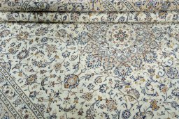 Close-up detail of 2000s Kashan rug from Iran / Persia showing Wool weave