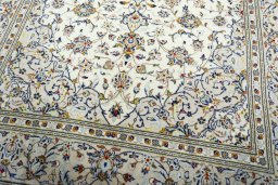 Close-up detail of 2000s Kashan rug from Iran / Persia showing Wool weave