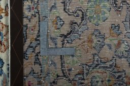 Backside of handmade 2000s Yazd rug showing knot structure and weave density