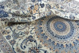 Surface texture of 2000s Nain rug with natural Wool and intricate pattern