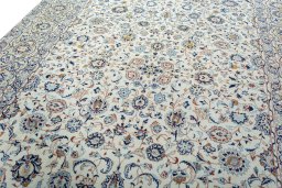 Backside of handmade 2000s Kashan rug showing knot structure and weave density