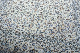 Close-up detail of 2000s Kashan rug from Iran / Persia showing Wool weave