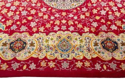 Corner detail of 2000s Kashan rug showing border pattern and Wool pile
