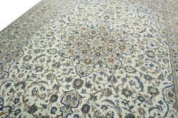 Backside of handmade 2000s Kashan rug showing knot structure and weave density