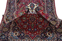 Surface texture of 2000s Kashan rug with natural Wool and intricate pattern