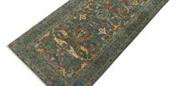 Backside of handmade New Farahan rug showing knot structure and weave density