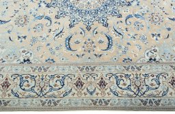Corner detail of 2000s Nain rug showing border pattern and Wool pile