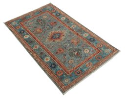 Corner detail of New Kazak rug showing border pattern and Wool pile