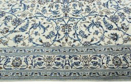 Corner detail of 2000s Nain rug showing border pattern and Wool pile