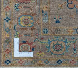 Corner detail of New Kazak rug showing border pattern and Wool pile