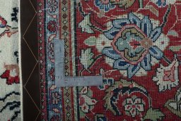 Backside of handmade 1970s Sarough rug showing knot structure and weave density