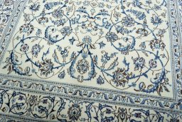 Close-up detail of 2000s Nain rug from Iran / Persia showing Wool weave