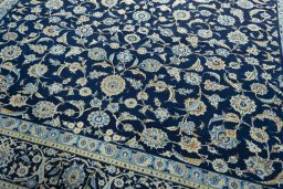 Close-up detail of 2000s Kashan rug from Iran / Persia showing Wool weave