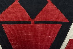 Backside of handmade New Modern Design rug showing knot structure and weave density