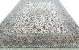 Surface texture of 2000s Kashan rug with natural Wool and intricate pattern