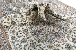 Surface texture of 2000s Kashan rug with natural Wool and intricate pattern