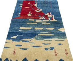 Surface texture of 2000s Persian Gabbeh rug with natural Wool and intricate pattern