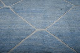 Backside of handmade New Morocco rug showing knot structure and weave density