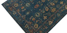 Backside of handmade New Farahan rug showing knot structure and weave density