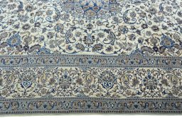 Corner detail of 2000s Nain rug showing border pattern and Wool pile