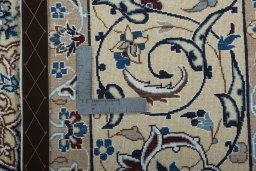 Backside of handmade 2000s Nain rug showing knot structure and weave density