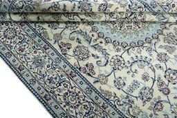 Close-up detail of 2000s Nain rug from Iran / Persia showing Wool weave